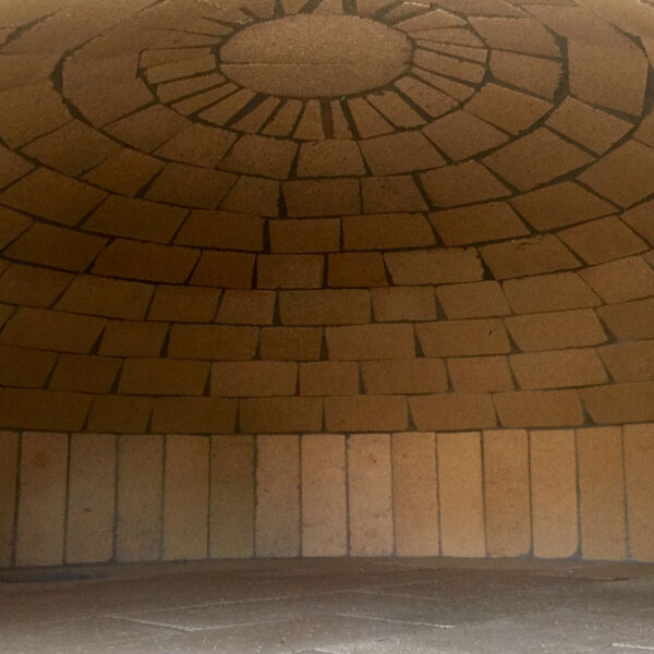 A brick dome in a pizza oven crafted by Forno Nardona.