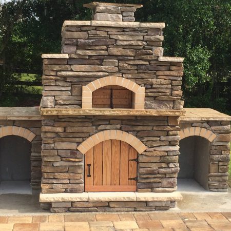 Rustic Nardona Firenze multi-tired outdoor oven with two side bars and wooden doors.