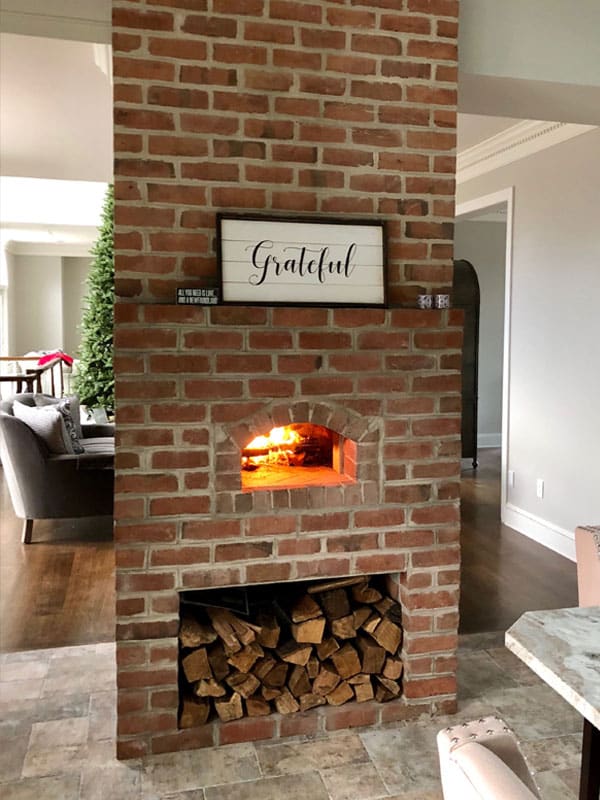 Forno Nardona Indoor Pizza Oven installed in a converted red brick chimney.