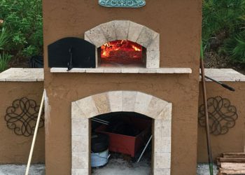 A custom outdoor wood-fired pizza oven