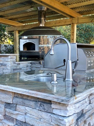 A newly built outdoor kitchen built around a Forno Nardona Napoli Model pizza oven.