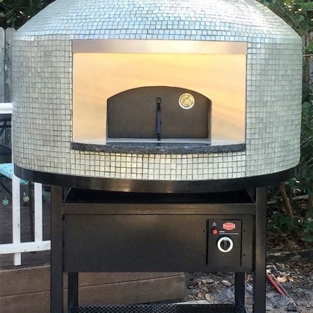 Nardona Napoli wood fired pizza oven on a stand with a gas burner.