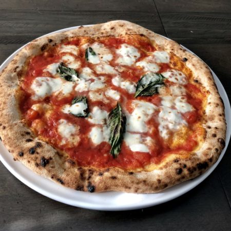 Fresh Neapolitan pizza that was made in a residential pizza oven