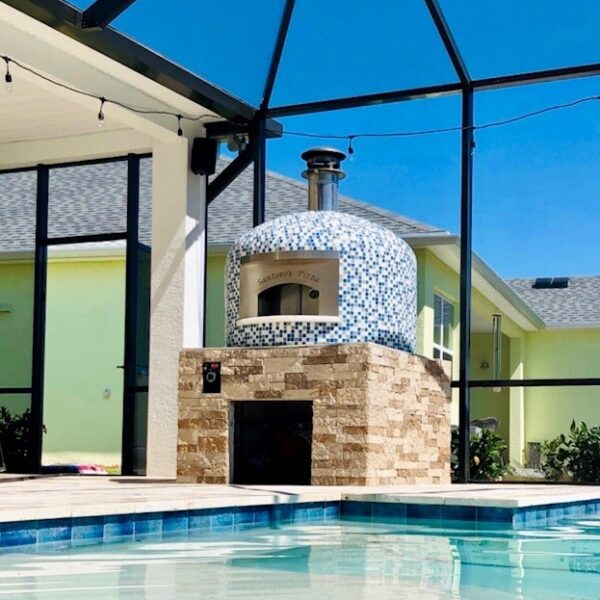 Forno Nardona Napoli Model Oven in blue moon blend glass tile with gas assist poolside.