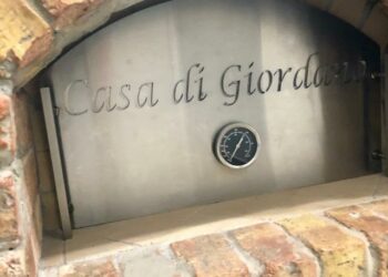 A custom engraved stainless steel plate on a pizza oven made by Forno Nardana.