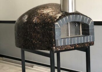 Forno Nardona Rustica custom brick dome pizza oven with back fire brick front on a custom stand.