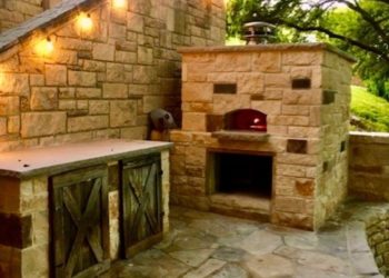 A large, stone outdoor pizza oven