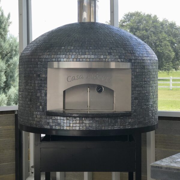 Forno Nardona Napoli oven with personalized face plate "Casa Liberti" and Vidrepur Glass Mosaic Moon Collection tile.