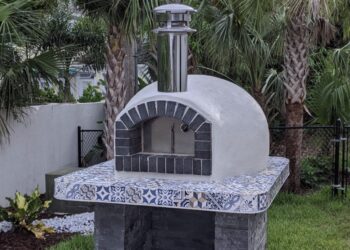 Forno Nardona Rustico Oven with black firebrick face and white stucco dome installed on a customer built base.