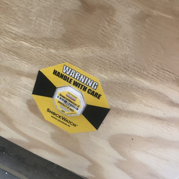 Photo of Shock Sensor placed on shipping crate.
