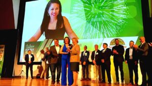 Fast 56 USF Awarded to Forno Nardona 10th place with USF graduate and co-owner of Forno Nardona Marie Hall on the big screen behind the people on stage.