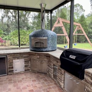 Forno Nardona Napoli Pizza Oven in Blue Moon Tile on a Forno Nardona outdoor kitchen featuring Premium Lion BBQ products.