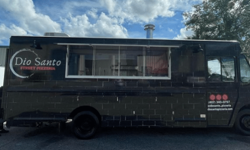 Exterior photo of a custom pizza food truck containing a Nardona Rustica Pizza Oven.