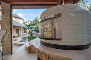 A prime example of Residential Napoli Ovens by Forno Nardona in white tile with an exterior engraved door "The Grangers"