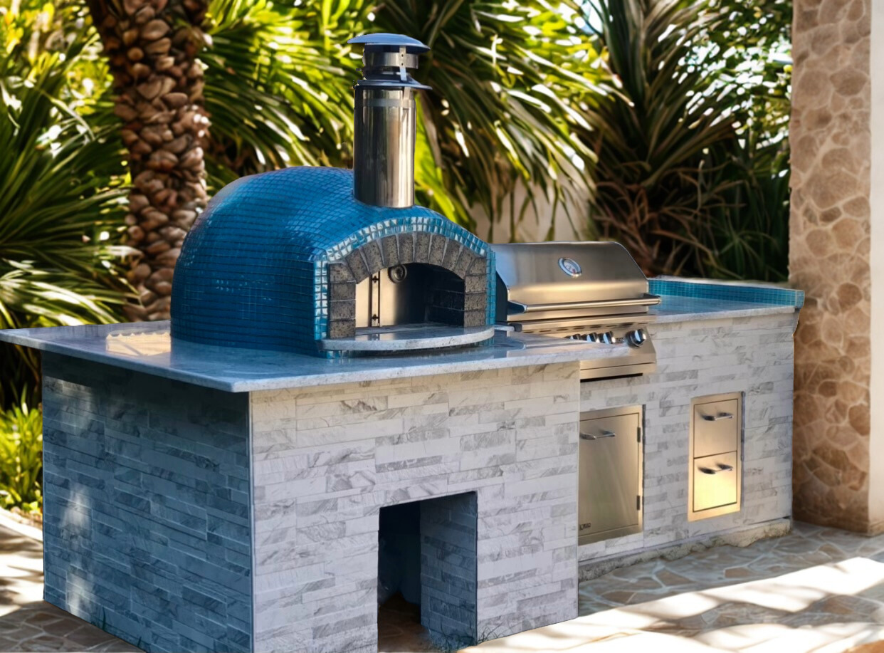 Outdoor Kitchen Materials for Florida Weather like this one with a blue tiled Rustico oven and stainless grill with stainless doors and drawers.