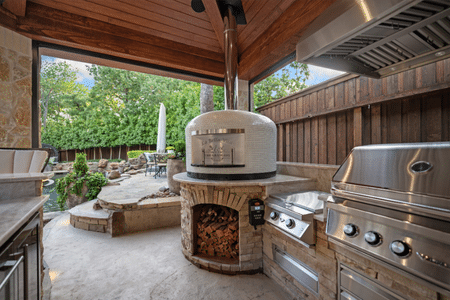 Residential Napoli brick pizza oven installed in a custom outdoor kitchen.